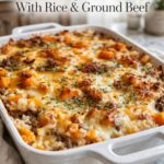 Butternut Beef Casserole with ground beef, butternut squash, rice, tomatoes, herbs, and melted cheese