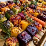 Vegetable Skewers with Brussels sprouts, sweet potato, butternut squash, carrots, beets, walnuts, and cranberry-honey glaze