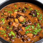 Black Bean Soup with black beans, tomatoes, carrots, celery, garlic, fresh herbs, and lemon