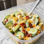 Cucumber Snack Bowl with cucumber, cottage cheese, eggs, chickpeas, tomatoes, herbs, and creamy lemon dressing