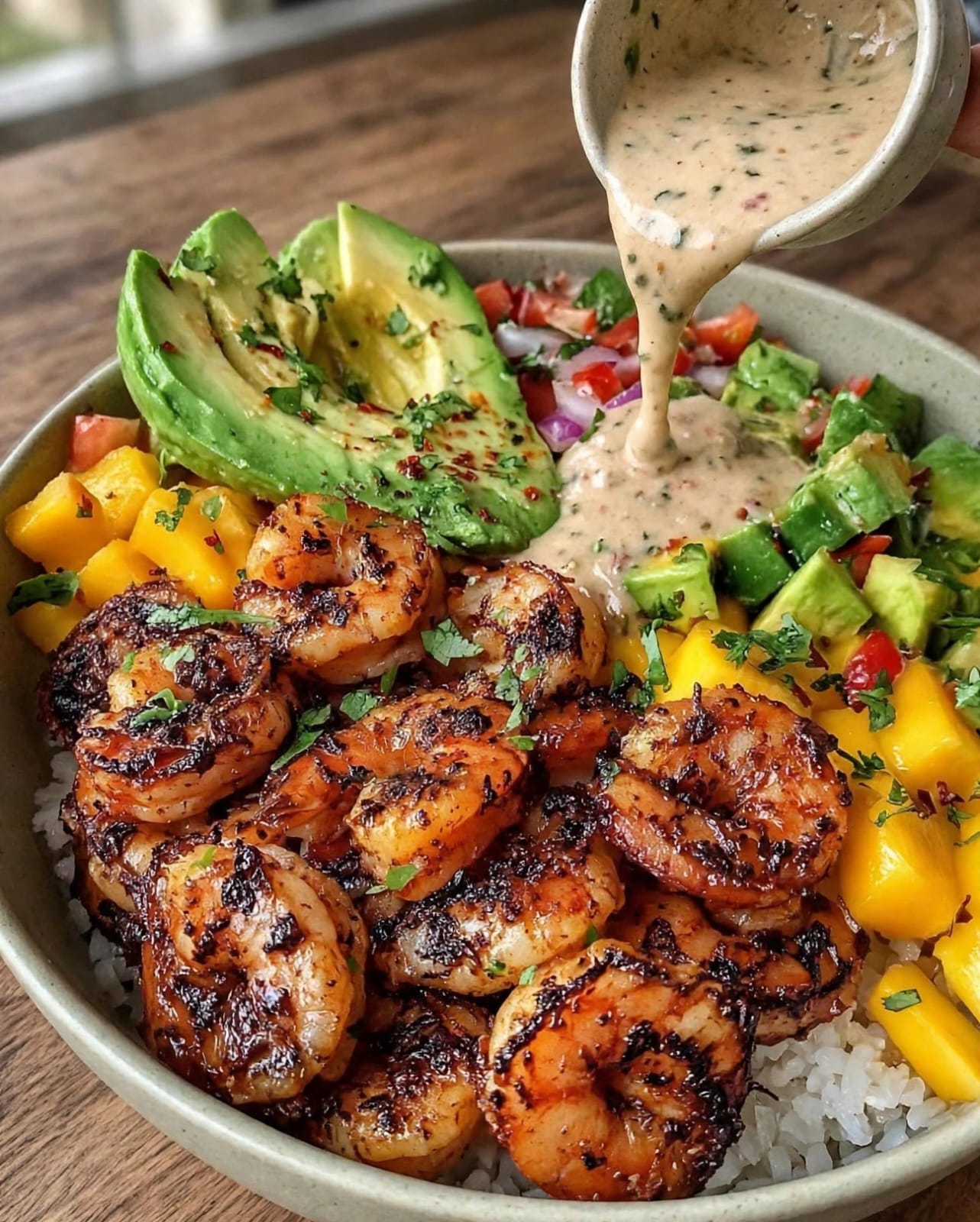 Shrimp Avocado Bowls with juicy shrimp, avocado, rice, tomatoes, cucumber, corn, black beans, and lime dressing