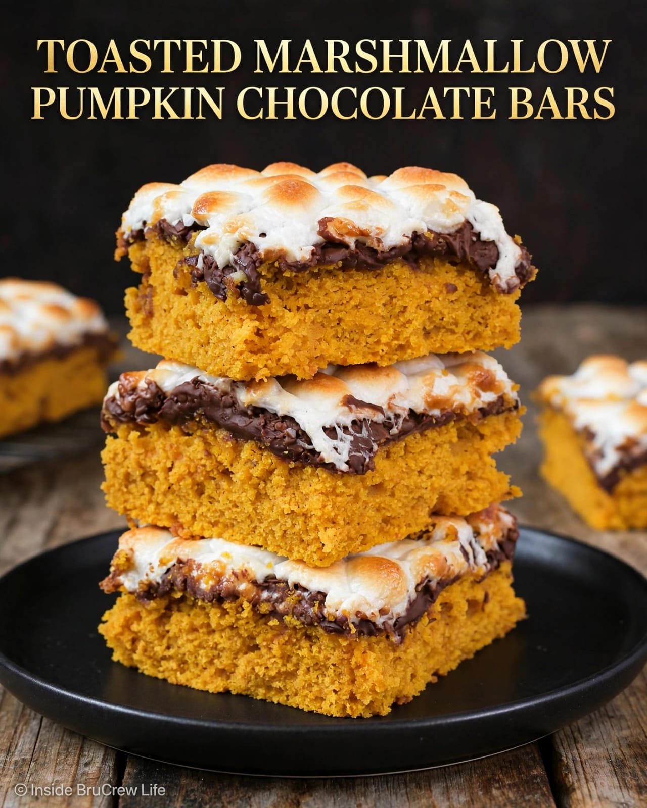 Pumpkin Chocolate Bars with pumpkin puree, chocolate chips, warm spices, and a toasted marshmallow topping