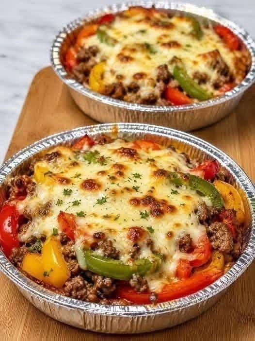 Crustless Pizza Bake with seasoned ground beef, pizza sauce, pepperoni, vegetables, mozzarella, and Parmesan